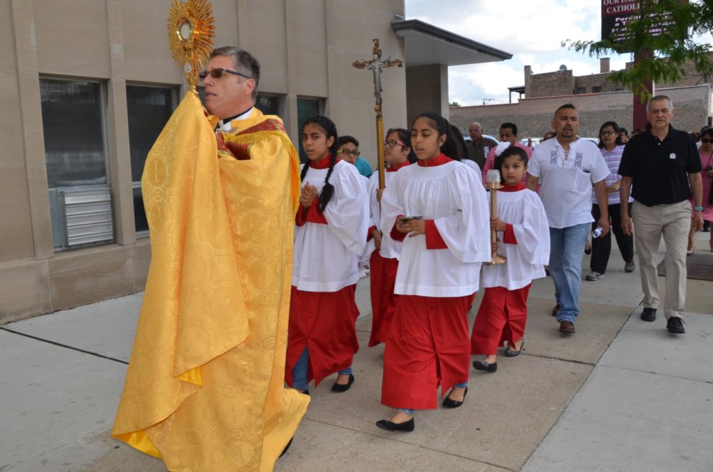 Procession with the Blessed Sacrament, Father is followed by Altar Servers